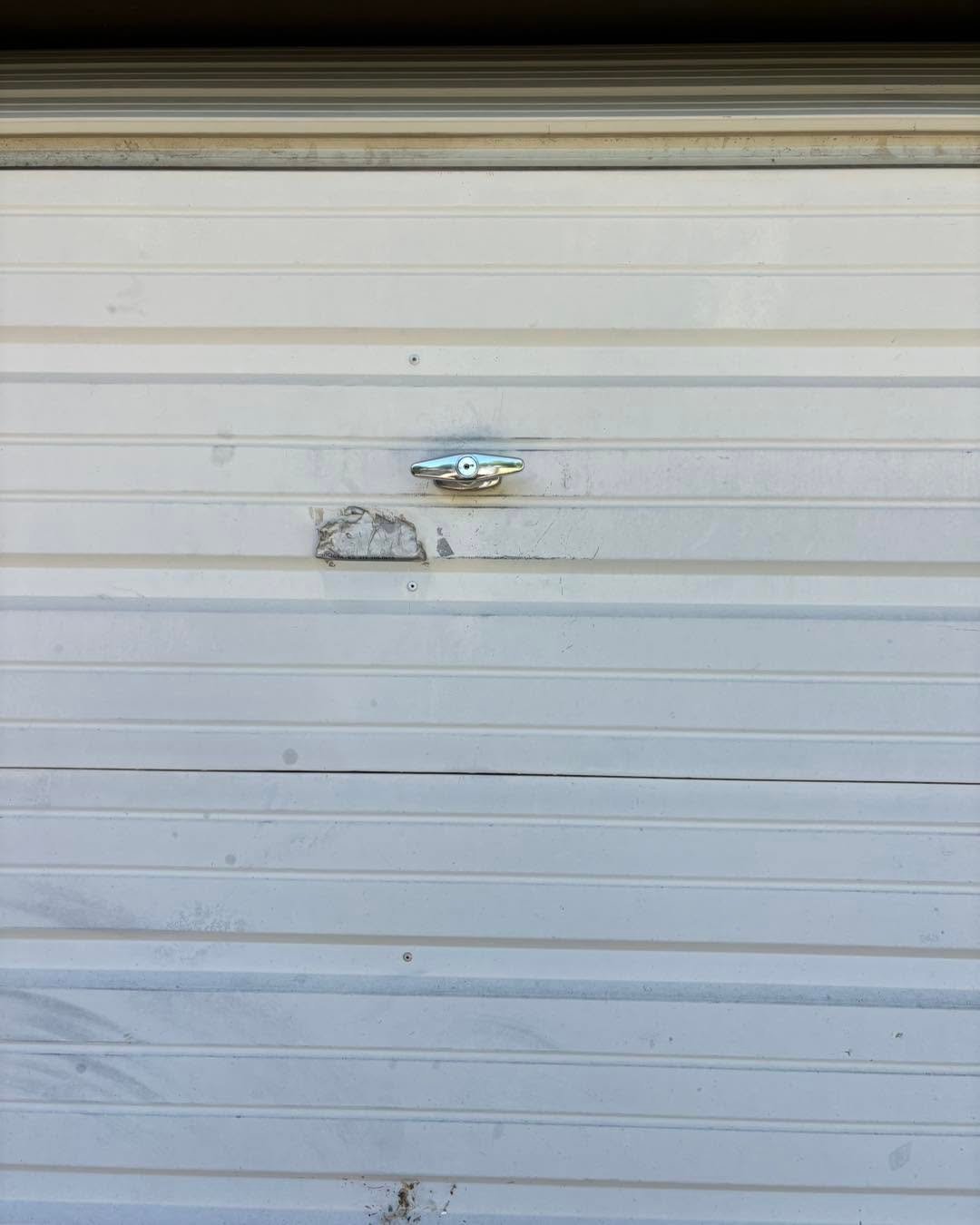 Unlock Genie garage door T-handle and track repair near Dr. Glen Dey Park in Wichita, Kansas